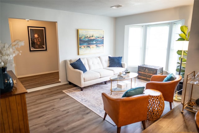 710 Melrose Dr, Richardson, TX 75080 - living room featuring wood finished floors and baseboards