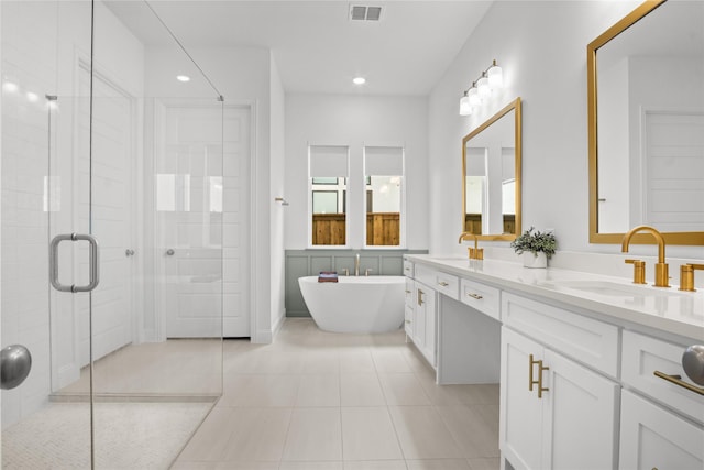 14524 Capridge Rd, Aledo, TX 76008 - bathroom with a shower stall, a soaking tub, double vanity, tile patterned flooring, and recessed lighting
