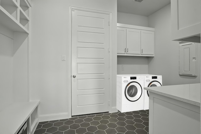 14524 Capridge Rd, Aledo, TX 76008 - laundry room featuring cabinet space, dark tile patterned floors, washer and dryer, and baseboards