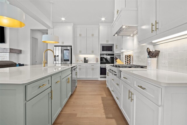 14524 Capridge Rd, Aledo, TX 76008 - kitchen featuring stainless steel appliances, light countertops, white cabinets, recessed lighting, and light wood finished floors