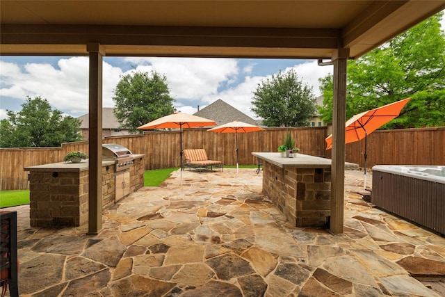 604 Carnaby Ct, Roanoke, TX 76262 - view of patio / terrace featuring an outdoor kitchen, a fenced backyard, and a grill