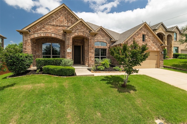 604 Carnaby Ct, Roanoke, TX 76262 - french provincial home featuring brick siding, concrete driveway, and a front yard