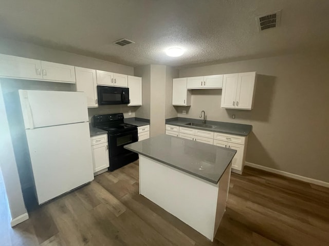 236 Ezekial Ave, Dallas, TX 75217 - kitchen with black appliances, a sink, dark wood-style flooring, white cabinets, and a textured ceiling