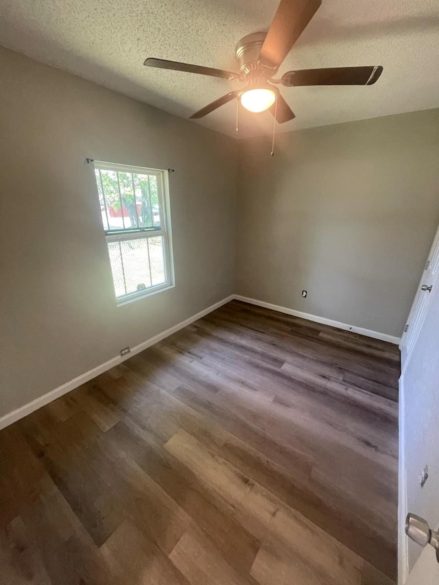 236 Ezekial Ave, Dallas, TX 75217 - empty room with ceiling fan, dark wood finished floors, a textured ceiling, and baseboards
