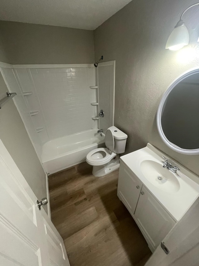236 Ezekial Ave, Dallas, TX 75217 - bathroom with wood finished floors, vanity, toilet, and bathing tub / shower combination
