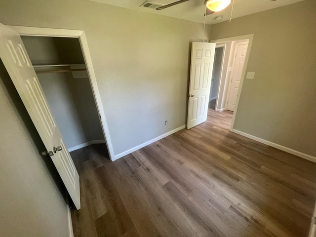 236 Ezekial Ave, Dallas, TX 75217 - unfurnished bedroom with dark wood-type flooring, baseboards, and a closet