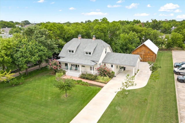 404 E Wall St, Grapevine, TX 76051 - view of front of house featuring covered porch, a front lawn, concrete driveway, a chimney, and a carport