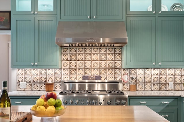 404 E Wall St, Grapevine, TX 76051 - kitchen with range hood, green cabinets, decorative backsplash, and glass insert cabinets