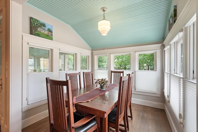 404 E Wall St, Grapevine, TX 76051 - dining room featuring vaulted ceiling, healthy amount of natural light, baseboards, and light wood-style flooring