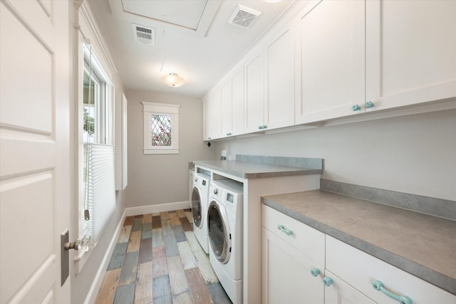 404 E Wall St, Grapevine, TX 76051 - laundry room featuring independent washer and dryer, cabinet space, wood finished floors, and baseboards