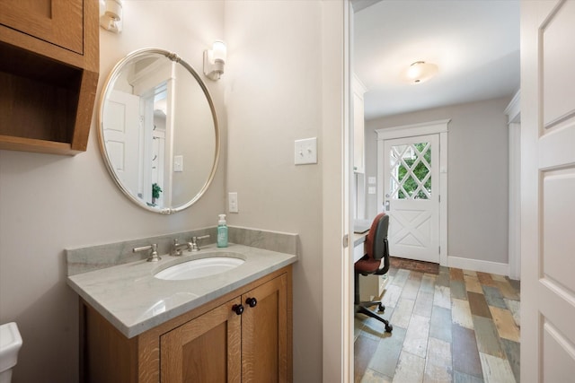 404 E Wall St, Grapevine, TX 76051 - bathroom featuring vanity and wood finished floors