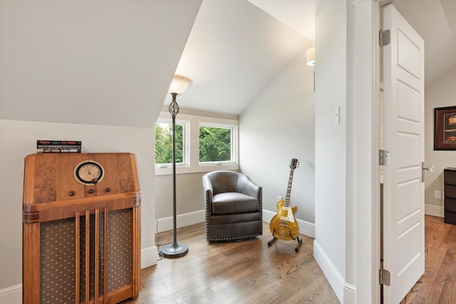 404 E Wall St, Grapevine, TX 76051 - living area with lofted ceiling, wood finished floors, and baseboards