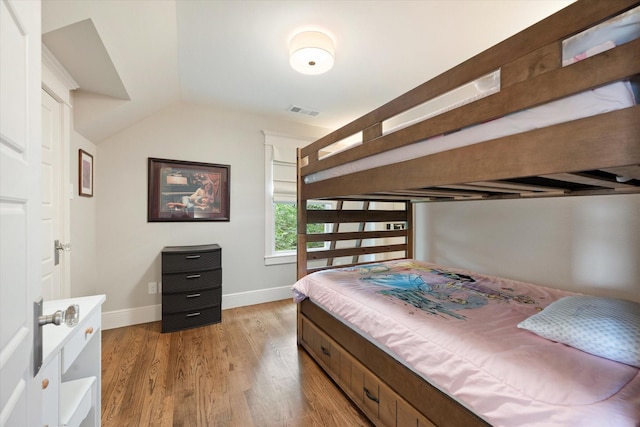 404 E Wall St, Grapevine, TX 76051 - bedroom with light wood-type flooring, baseboards, and lofted ceiling