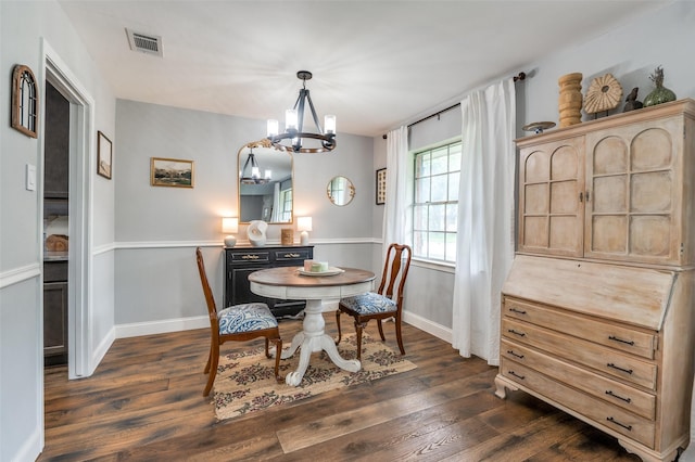 309 Westpark Dr N, Mckinney, TX 75071 - dining space featuring a chandelier, dark wood-style floors, and baseboards