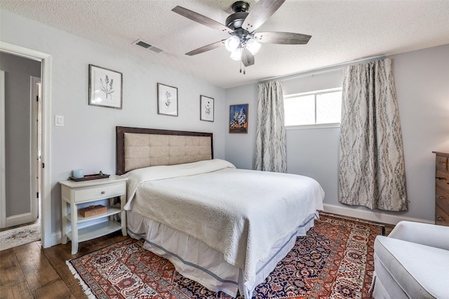 309 Westpark Dr N, Mckinney, TX 75071 - bedroom featuring a textured ceiling, wood-type flooring, and ceiling fan