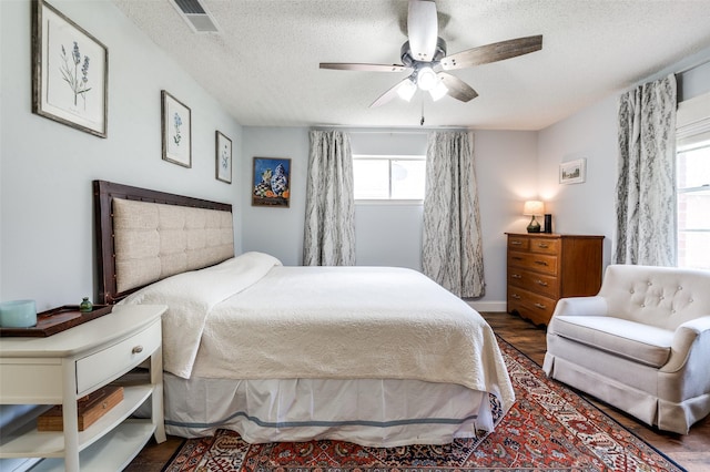 309 Westpark Dr N, Mckinney, TX 75071 - bedroom with wood finished floors, a textured ceiling, and a ceiling fan
