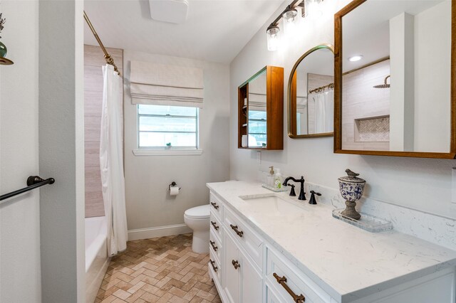 309 Westpark Dr N, Mckinney, TX 75071 - full bathroom with vanity, toilet, shower / tub combo, brick patterned flooring, and baseboards