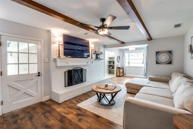 309 Westpark Dr N, Mckinney, TX 75071 - living area featuring beamed ceiling, wood finished floors, baseboards, ceiling fan, and a brick fireplace