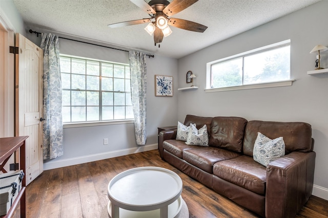 309 Westpark Dr N, Mckinney, TX 75071 - living room with a ceiling fan, wood finished floors, baseboards, and a textured ceiling