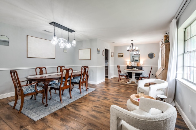 309 Westpark Dr N, Mckinney, TX 75071 - dining area with a chandelier, dark wood-style flooring, and baseboards
