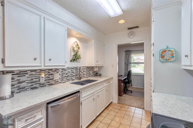 1001 Chriswood Dr, Abilene, TX 79601 - kitchen with a sink, dishwasher, a textured ceiling, white cabinetry, and recessed lighting