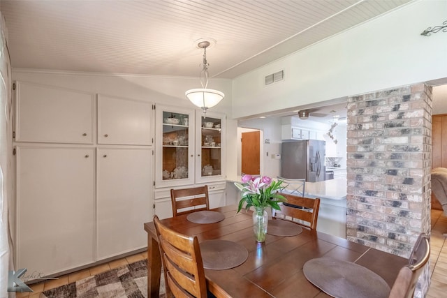 1001 Chriswood Dr, Abilene, TX 79601 - dining area featuring crown molding and light tile patterned floors