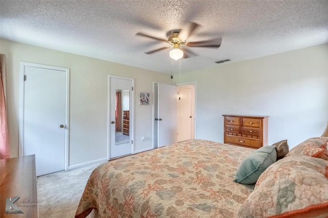 1001 Chriswood Dr, Abilene, TX 79601 - bedroom featuring carpet floors, a ceiling fan, and a textured ceiling