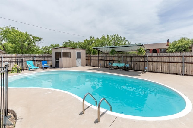 1001 Chriswood Dr, Abilene, TX 79601 - view of pool featuring an outbuilding, a fenced backyard, a patio, and a shed