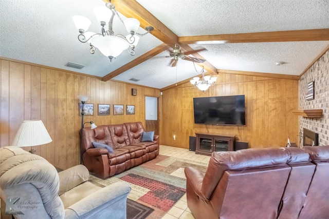 1001 Chriswood Dr, Abilene, TX 79601 - tiled living area with a chandelier, a textured ceiling, a brick fireplace, wooden walls, and a ceiling fan