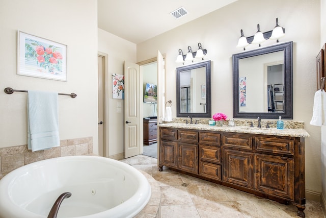 7503 Taylor Ln, Sachse, TX 75048 - bathroom with a jetted tub and double vanity