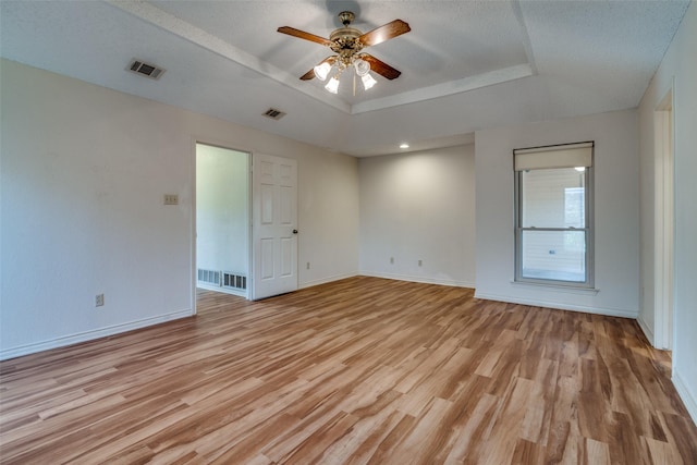3506 Carla Dr, Rowlett, TX 75088 - empty room featuring a raised ceiling, light wood finished floors, a ceiling fan, and baseboards
