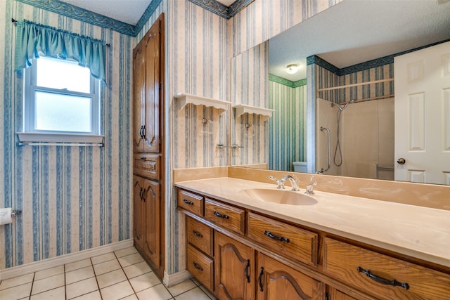 3506 Carla Dr, Rowlett, TX 75088 - full bath with wallpapered walls, tile patterned flooring, baseboards, vanity, and toilet