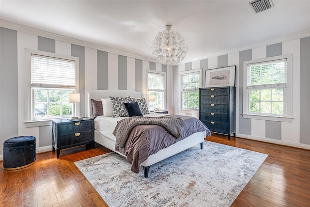 6802 Hammond Ave, Dallas, TX 75223 - bedroom featuring a chandelier, baseboards, wallpapered walls, crown molding, and multiple windows