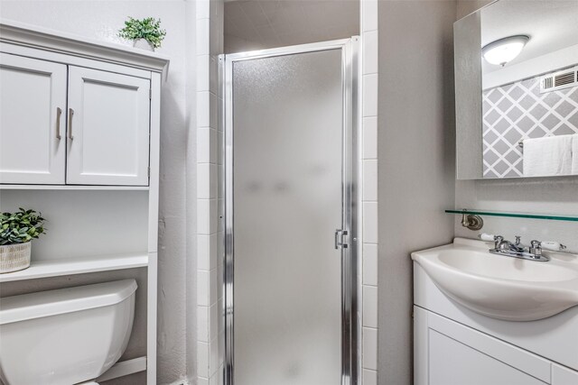 6802 Hammond Ave, Dallas, TX 75223 - full bath with a stall shower, vanity, and toilet