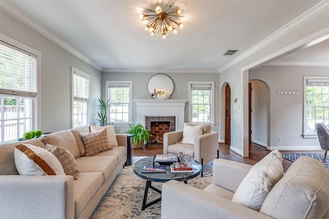6802 Hammond Ave, Dallas, TX 75223 - living area with arched walkways, healthy amount of natural light, a chandelier, wood finished floors, and ornamental molding