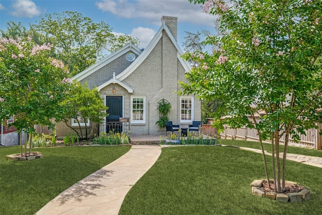 6802 Hammond Ave, Dallas, TX 75223 - view of front facade with brick siding and a chimney