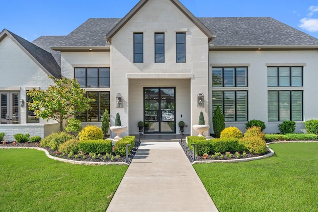 2012 Honey Ln, Celina, TX 75009 - entrance to property featuring a shingled roof, a yard, and brick siding