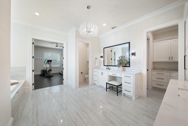 2012 Honey Ln, Celina, TX 75009 - bathroom with toilet, vanity, crown molding, a chandelier, and tiled tub