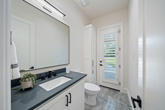 2012 Honey Ln, Celina, TX 75009 - half bathroom featuring toilet, vanity, and baseboards