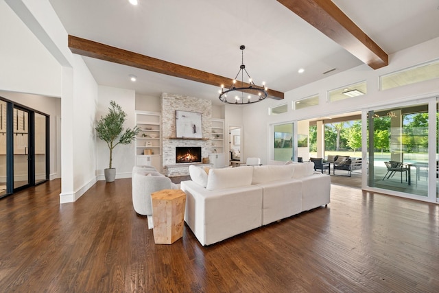2012 Honey Ln, Celina, TX 75009 - living room with beamed ceiling, dark wood-style flooring, baseboards, a fireplace, and a chandelier