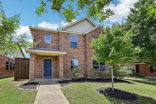 8808 Eastwood Ave, Cross Roads, TX 76227 - traditional home featuring a front lawn and brick siding