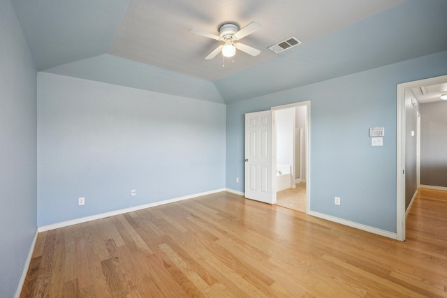 8808 Eastwood Ave, Cross Roads, TX 76227 - unfurnished bedroom featuring vaulted ceiling, light wood finished floors, baseboards, attic access, and ensuite bath