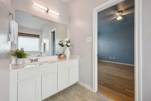 8808 Eastwood Ave, Cross Roads, TX 76227 - bathroom with ceiling fan, vanity, baseboards, and wood finished floors