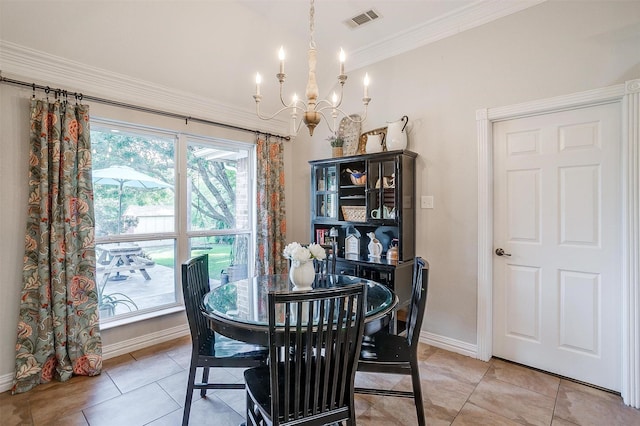 725 Bluebird St, Fort Worth, TX 76140 - dining space with a chandelier, baseboards, ornamental molding, and light tile patterned flooring