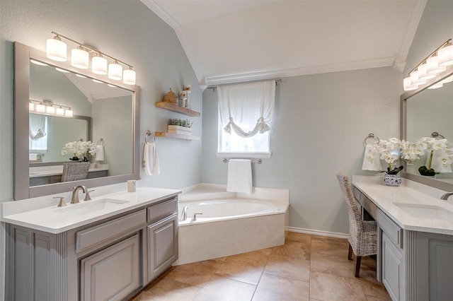 725 Bluebird St, Fort Worth, TX 76140 - bathroom featuring ornamental molding, two vanities, a garden tub, and lofted ceiling