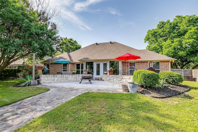 725 Bluebird St, Fort Worth, TX 76140 - back of property featuring a patio, brick siding, a shingled roof, and french doors