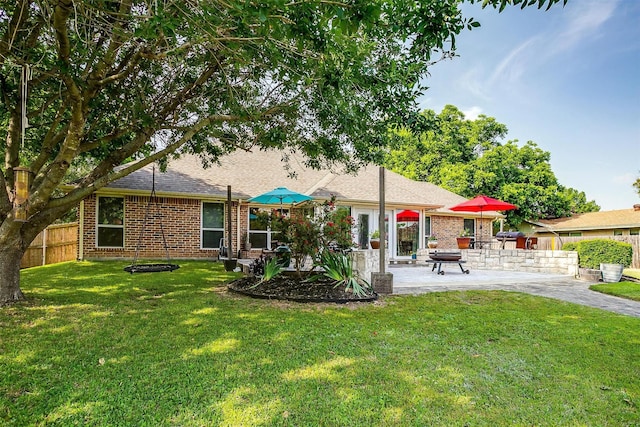 725 Bluebird St, Fort Worth, TX 76140 - rear view of house featuring a patio area, brick siding, and a shingled roof