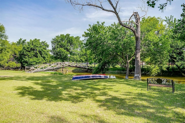 725 Bluebird St, Fort Worth, TX 76140 - view of community with a yard, a water view, and view of scattered trees