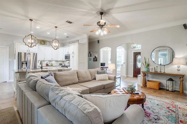 725 Bluebird St, Fort Worth, TX 76140 - living room featuring arched walkways, ornamental molding, light tile patterned flooring, recessed lighting, and a ceiling fan
