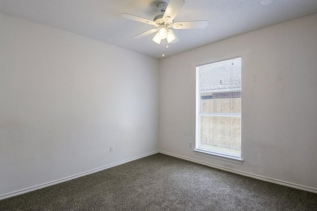 307 Apache Trl, Alvarado, TX 76009 - empty room featuring dark colored carpet, a ceiling fan, and baseboards